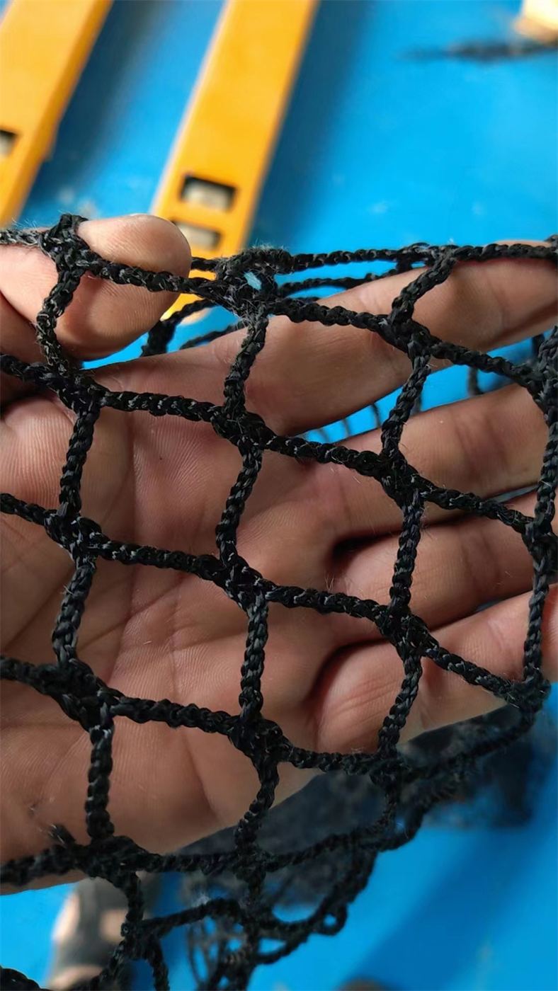 Black knotless braided net held in a hand